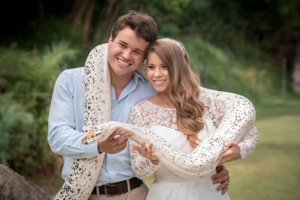 Australia-Zoo-wedding-venue-couple-newlyweds-bride-and-groom-portrait-holding-a-snake