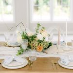 A meticulously designed wedding tablescape with elegant decor and pastel tones, showcasing ideas for planning your Queensland wedding
