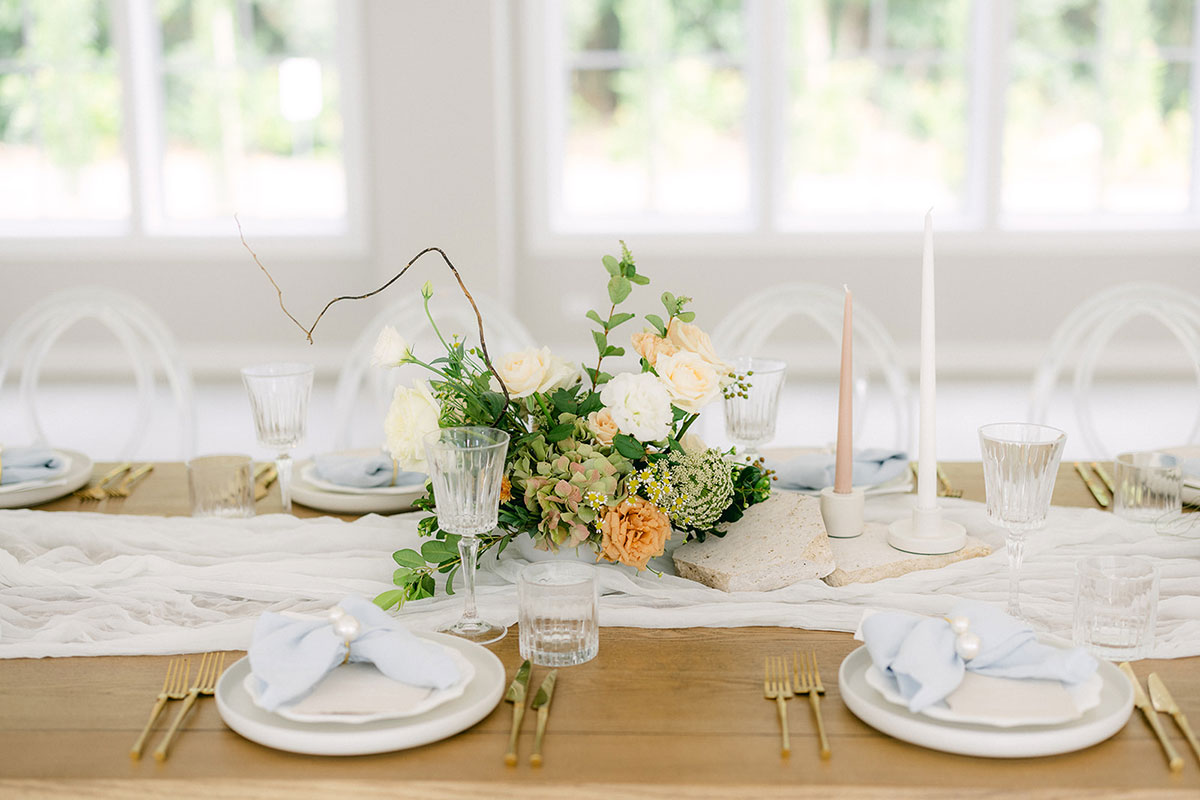 A meticulously designed wedding tablescape with elegant decor and pastel tones, showcasing ideas for planning your Queensland wedding