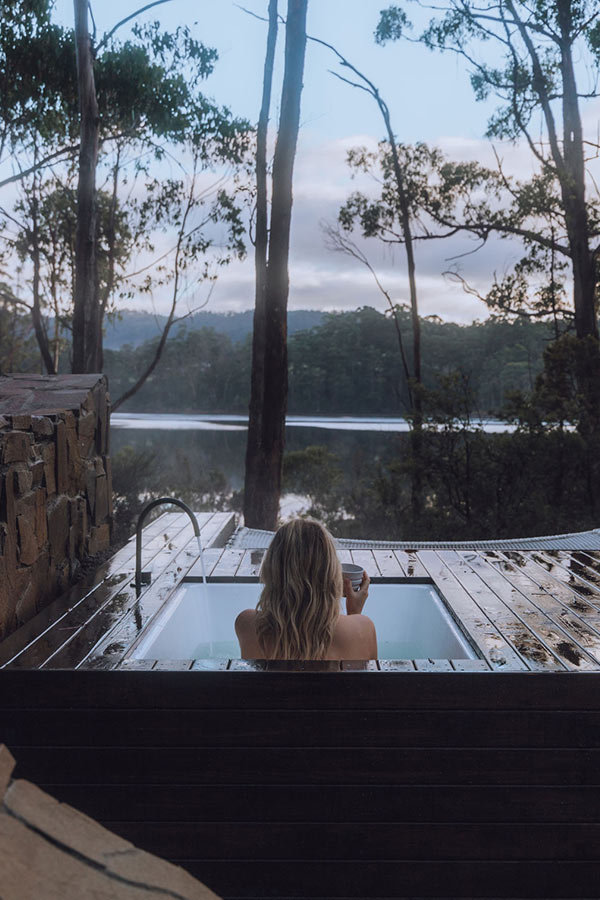 Unwind in the serene embrace of Tasmania’s Huon Valley at The Voyager, an Airbnb residence offering breathtaking views from a secluded outdoor tub